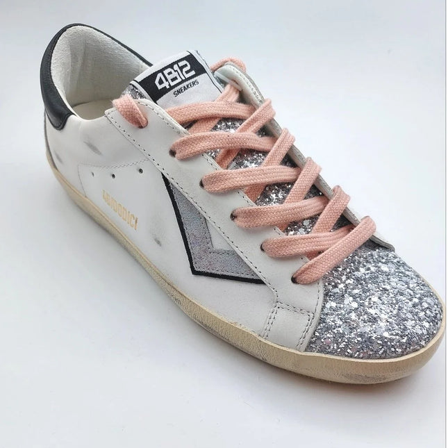 4B12 Supreme 310 trainer with silver and pink details